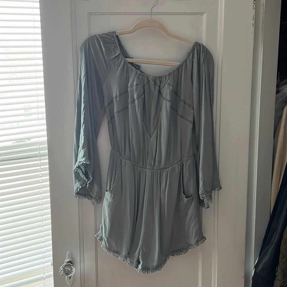 Cute boho teal romper with dramatic sleeve